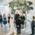 View from above of a couple stands in front of their officiant during a wedding ceremony in the pavilion.